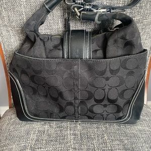 COACH black cloth shoulder bag with signature “C” design. Good condition